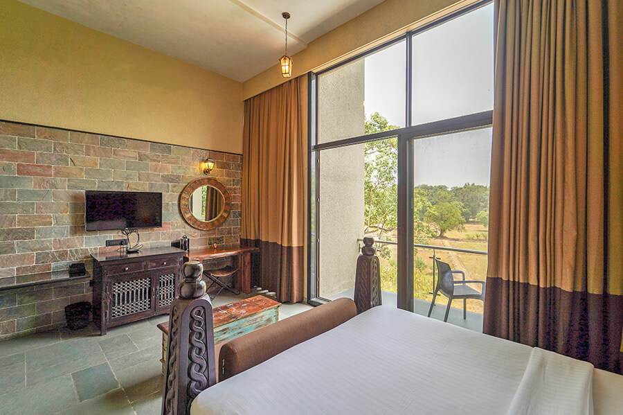 Premium room with balcony at Lonavala hotels with swimming pool, perfect for relaxing weekend getaways near Mumbai