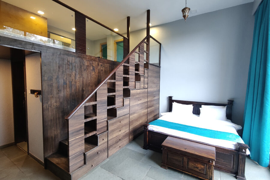 Spacious king room at a hotel near Lonavala market offering comfortable stay with easy access to local attractions
