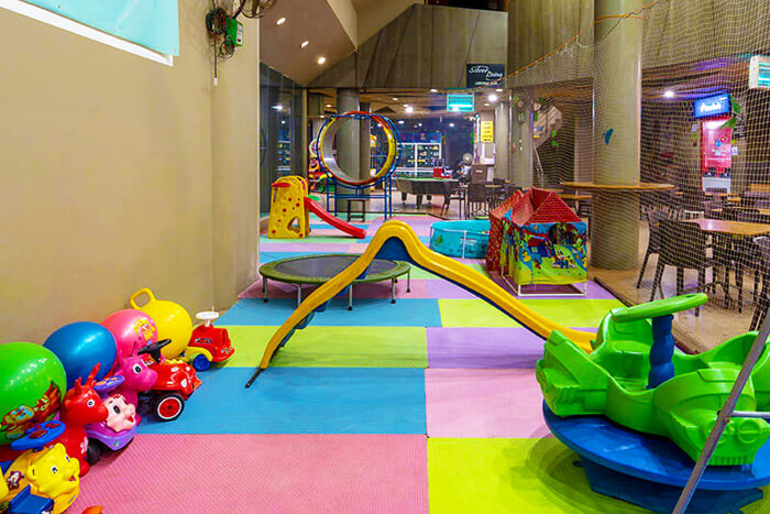 Kids enjoying indoor activities at a couple friendly hotel in Lonavala, perfect for fun-filled weekend getaways near Mumbai